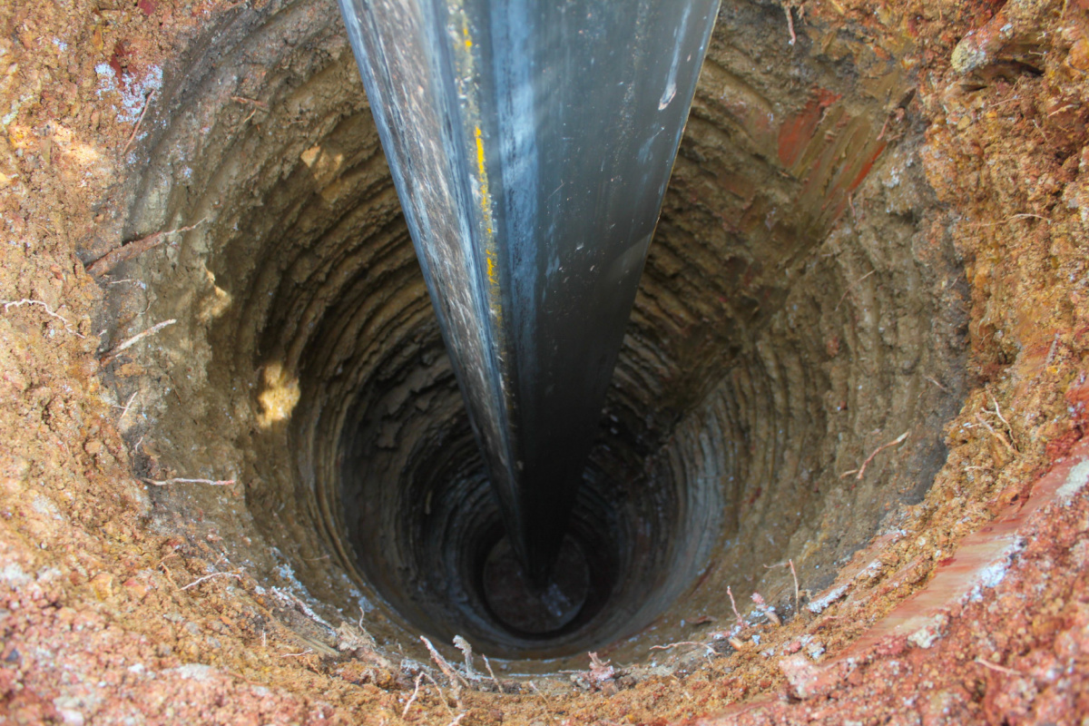 A close-up of the well drilling process.